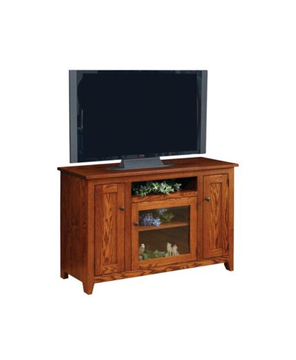 The Modern Mission TV Stand features a sturdy solid wood construction with two side cabinets and a central open shelf with a glass door.