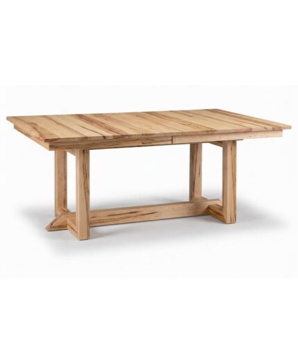 The Audrey Trestle Table offers a solid wood dining surface supported by a sturdy trestle base with intersecting supports.