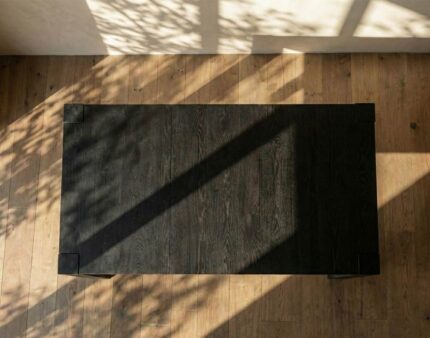 The Catalina Leg Table showcases a solid wood construction with a substantial, sturdy frame and distinct corner block details.