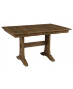 The Sadie Trestle Table showcases a solid wood, handcrafted design with a sturdy trestle base and clean lines, perfect for dining.