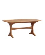 The Kirkland Trestle Table features a solid wood construction with elegant, curved trestle legs and a connecting stretcher for a sturdy dining experience.