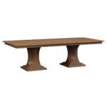 The Berkley Double Pedestal Table is a dining piece featuring a rectangular top supported by two robust, curved pedestals with layered bases.