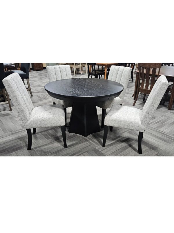 This clearance Brogan Table and Wittenburg Chairs set features a round pedestal base and four channel-tufted dining chairs.