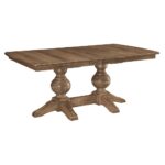 This Bradley Double Pedestal Table is a solid wood dining table with a rectangular top and two large turned pedestals.