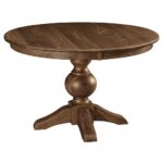 The Bradley Single Pedestal Table is a round dining table with a substantial turned pedestal base and four splayed feet.