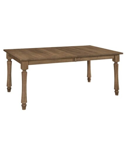 This Carlin Leg Table is a solid wood dining table with a rectangular top and four turned legs, ideal for any kitchen.