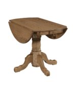 The Homestead Pedestal Drop Leaf Table features a sturdy dining surface with two rounded drop leaves and a carved pedestal base with four curved feet.