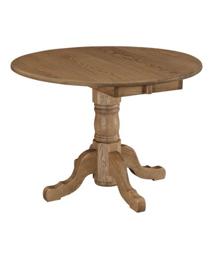 This Homestead Pedestal Drop Leaf Table is a solid wood dining table with a round top, a turned pedestal, and four curved feet.