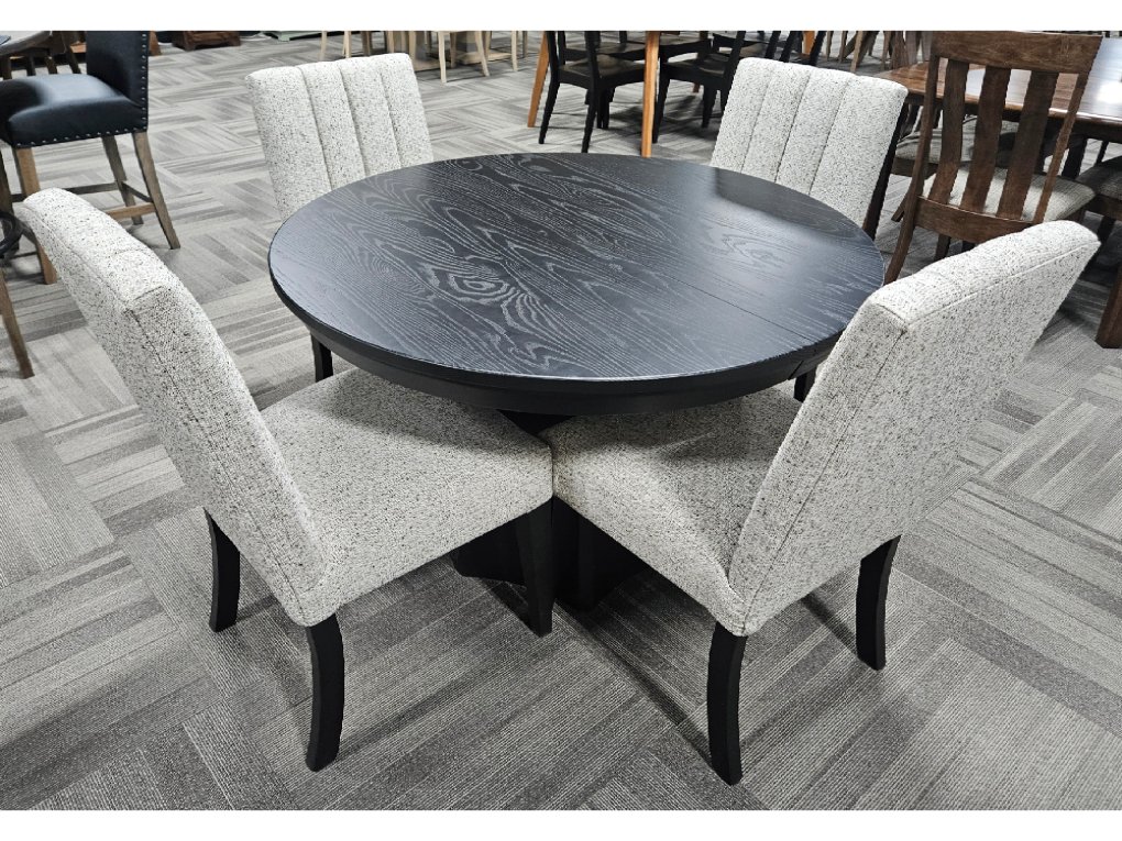 This clearance Brogan Table and Wittenburg Chairs set features a round top with four sleek, upholstered dining chairs.