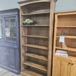 This clearance Traditional Bookcase - 84" High features a solid wood, arched top design with elegant molding.